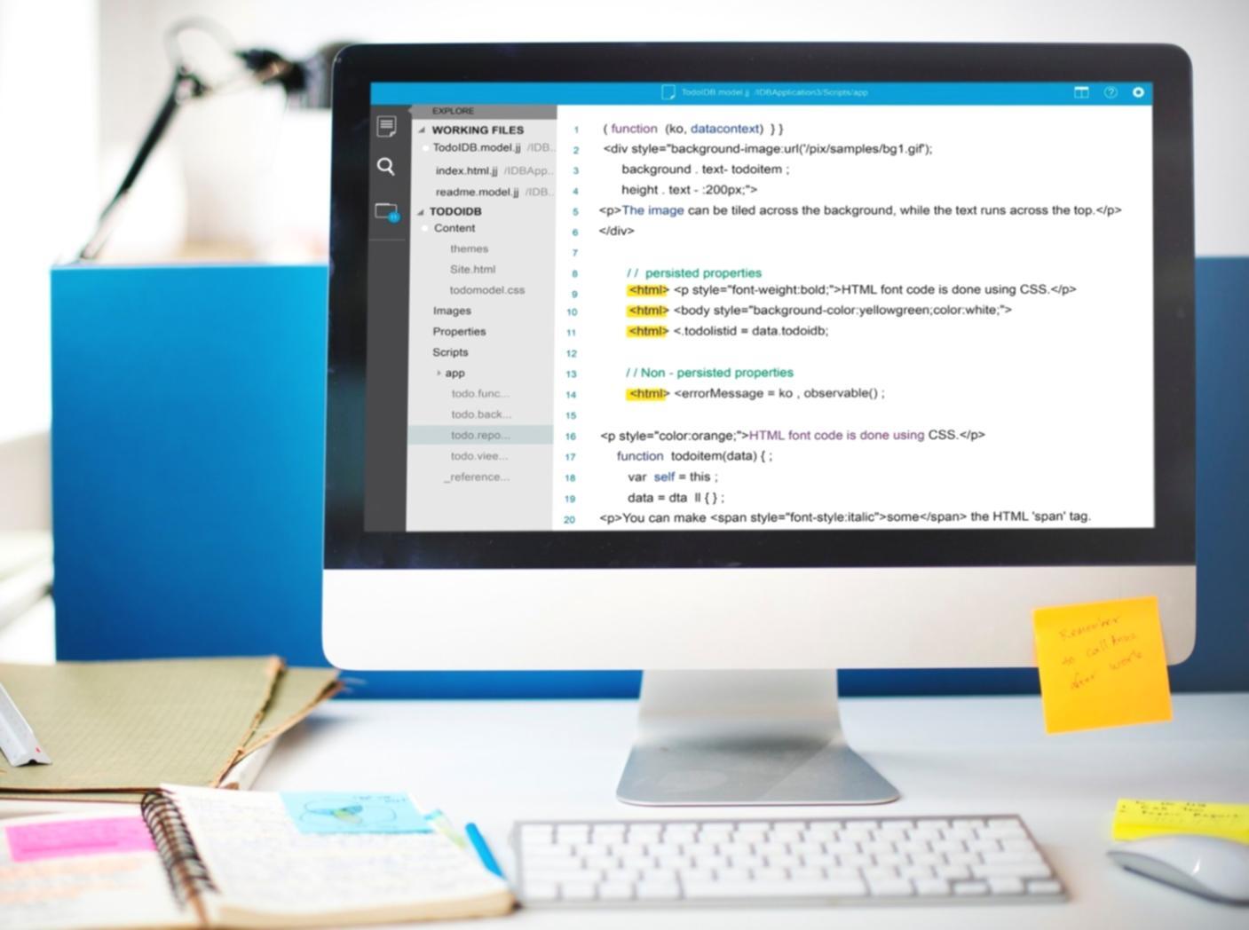 Instructor reviewing code with students during workshop session